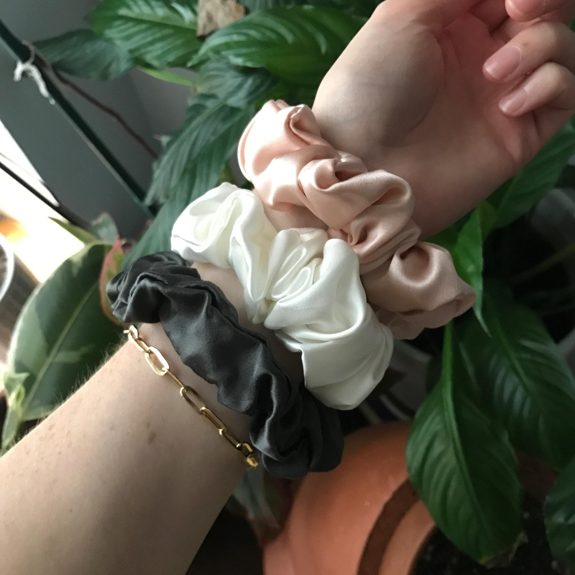 black, white, and pink scrunchies on Bek&#x27;s wrist