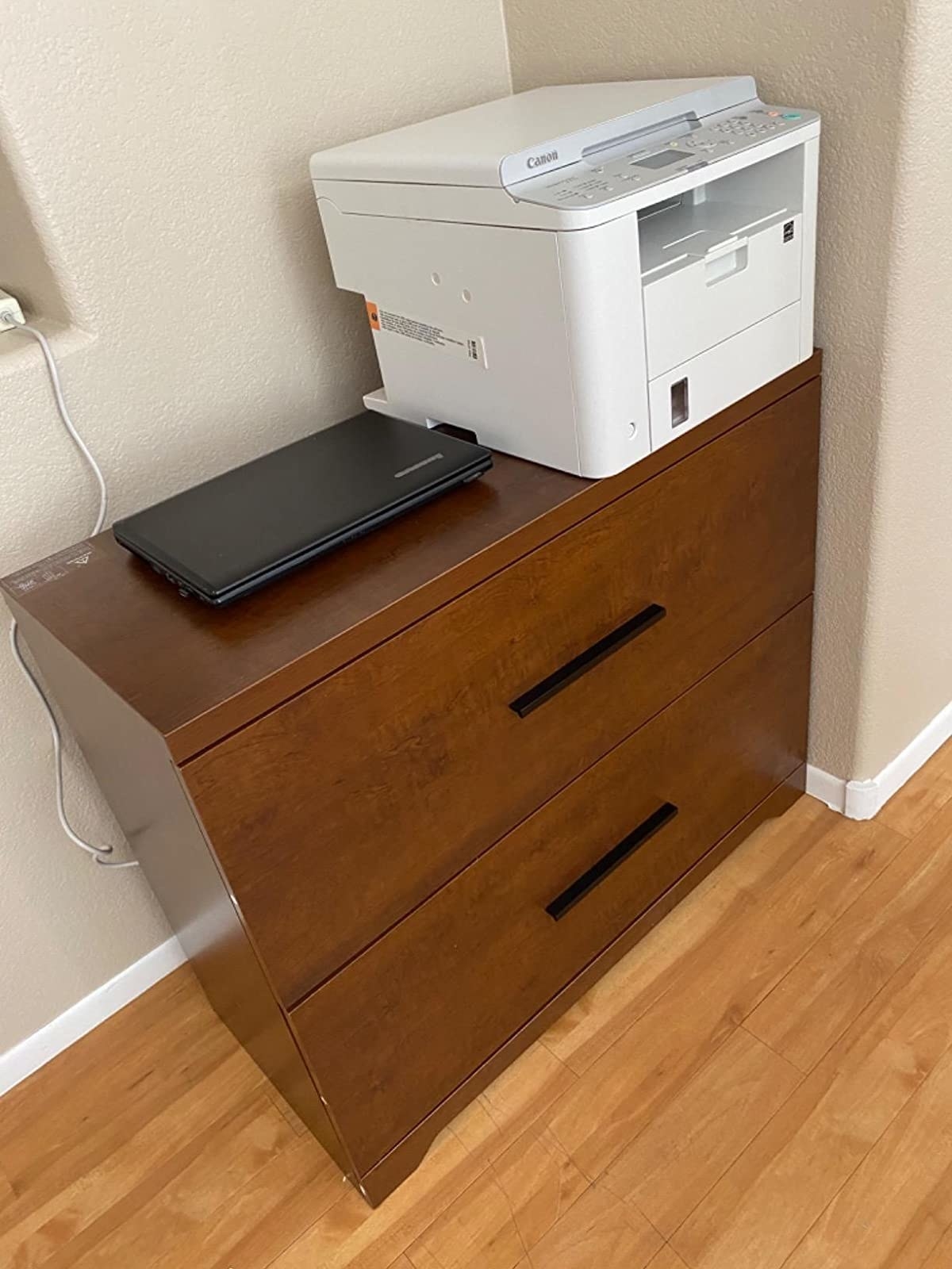 reviewer image of the devaise filing cabinet in an office with a scanner on top of it