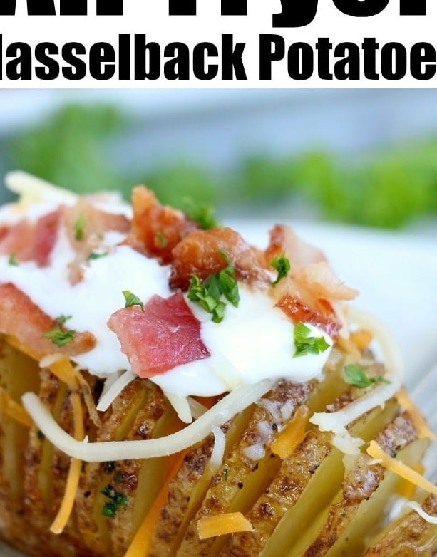 A hasselback potato topped with sour cream, bacon, herbs, and cheese.
