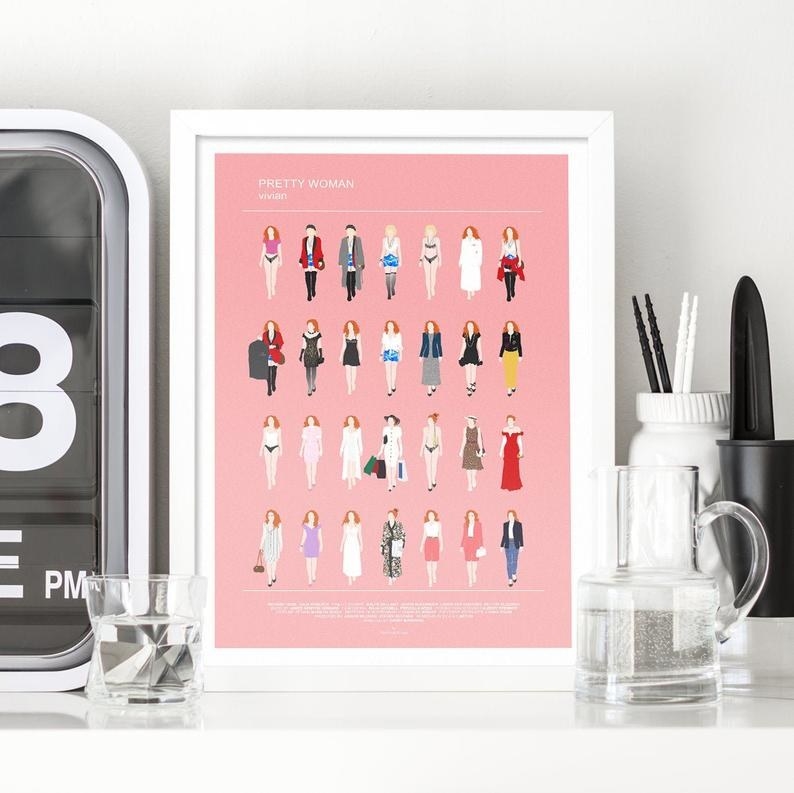 The pink background print that reads &quot;Pretty Woman: Vivian&quot; on the top and has 28 silhouettes of her in different outfits from the movie