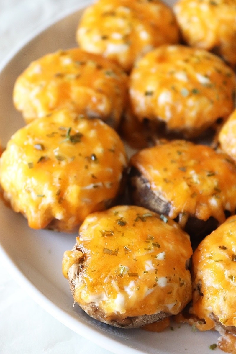 A plate of cheesy stuffed mushrooms.