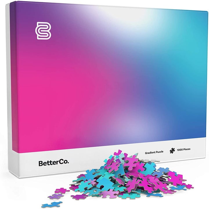 The box which shows the blue, teal, purple, and pink gradient puzzle and a small pile of pieces