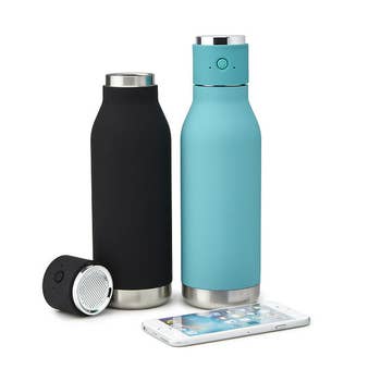 Black and teal Bluetooth water bottles next to smartphone