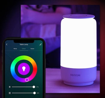 Smartphone with accompanying app in front of smart lamp