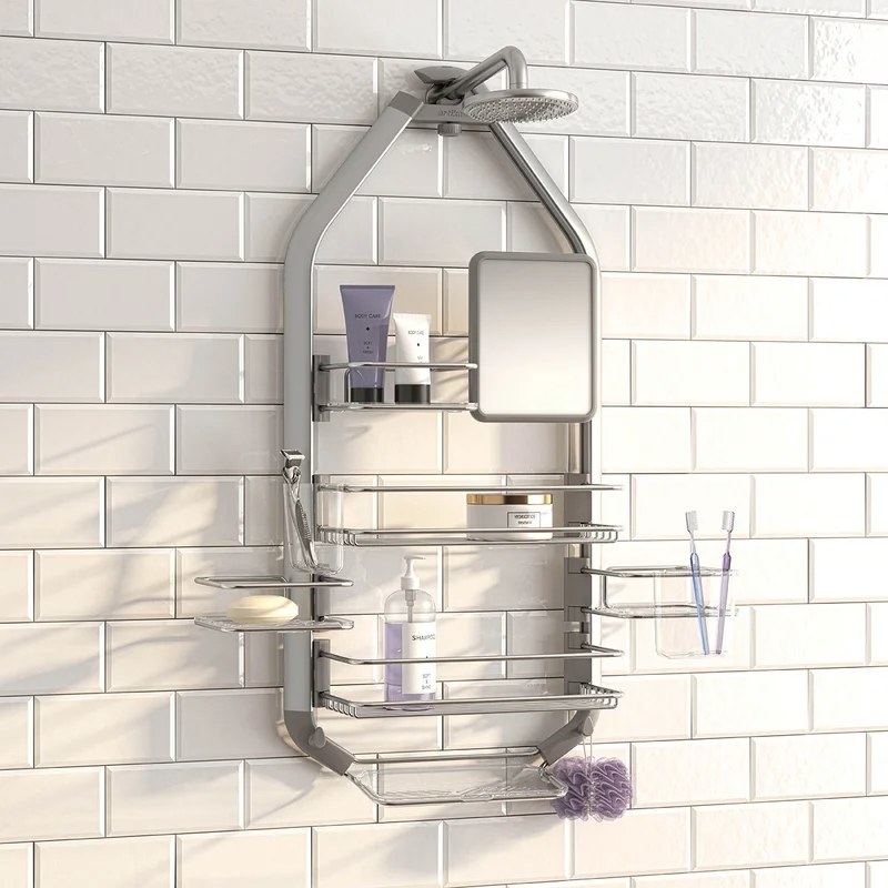 A silver shower caddy hanging from a showerhead with two long shelves, three short shelves, a cup, a soap dish, a mirror, and two hooks