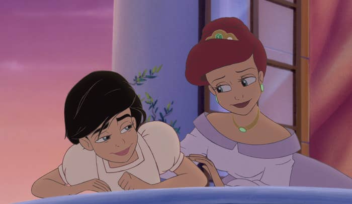 Ariel and her daughter Melody on a balcony at sunset.