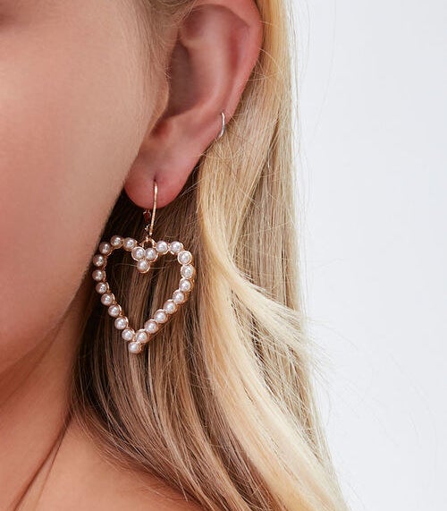 model wearing the heart earrings 