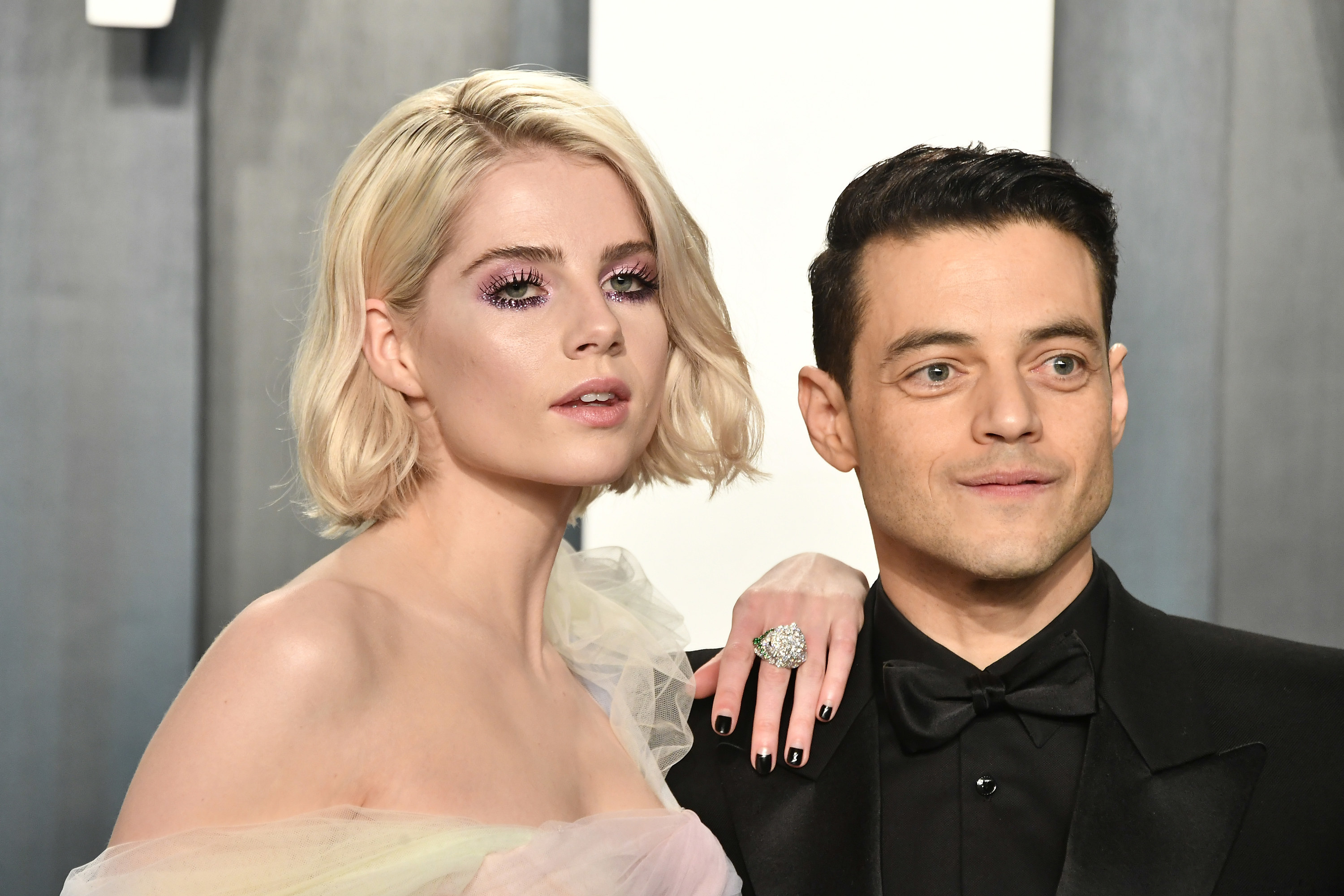 Lucy Boynton with her hand resting on Rami Malek&#x27;s shoulder