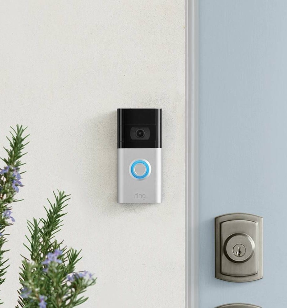 The Ring doorbell attached to the side of a door