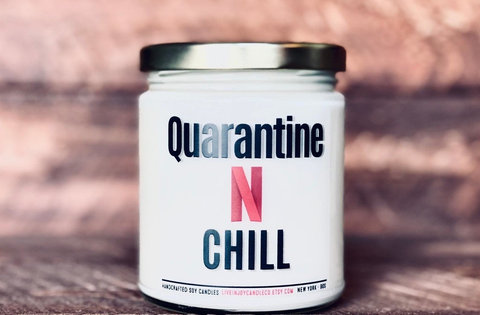 the candle with the label reading &quot;quarantine n chill&quot; on it 