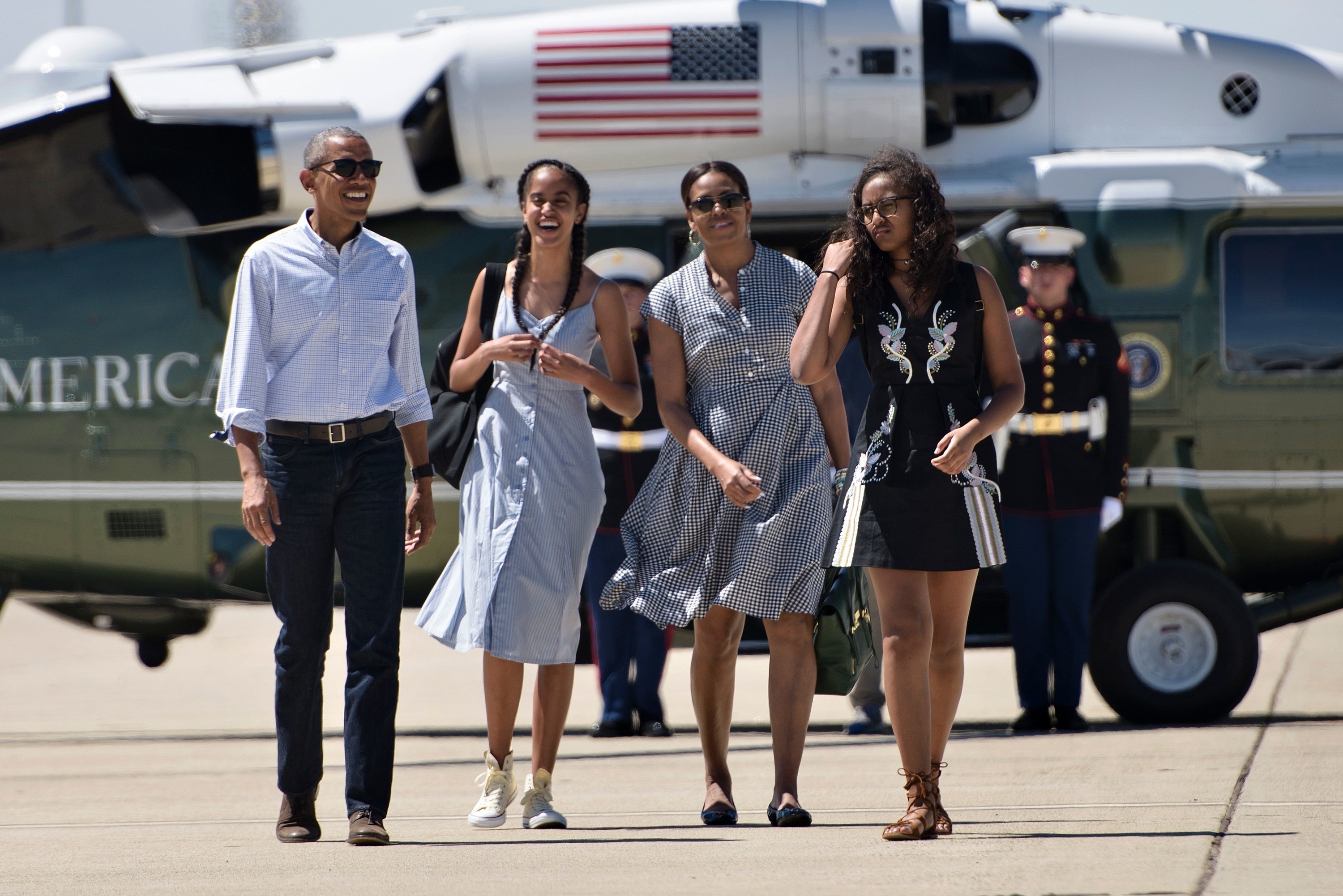 The former First Family smiling as they walk to Air Force One in 2016
