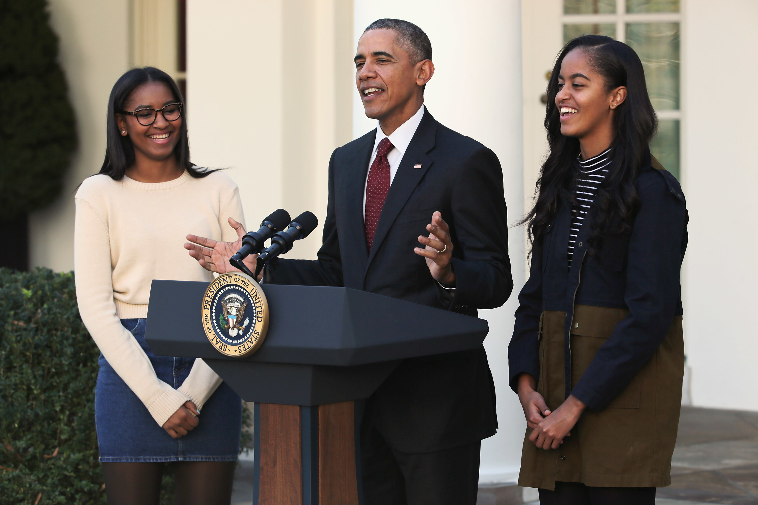 President Obama delivers remarks with his daughters Sasha and Malia during the annual turkey pardoning ceremony in 2015 