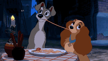 Lady and Tramp eating spaghetti in the original animated film