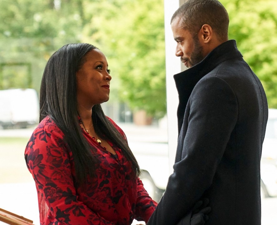 Keshia Knight Pulliam and Jarod Joseph hold hands while looking at each other and smiling