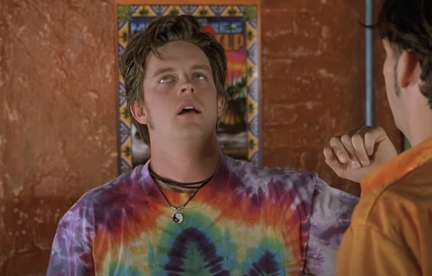 Breuer wears a tie-dyed shirt and looks very stoned in the film