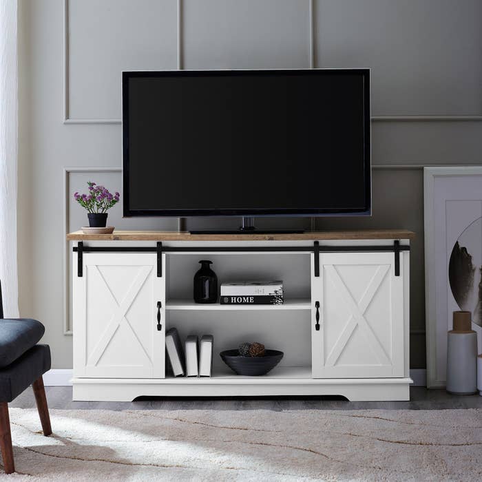 The white TV stand with a TV on top