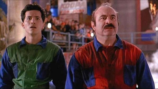 Hoskins and Leguizamo is colorful outfits as the Mario Bros