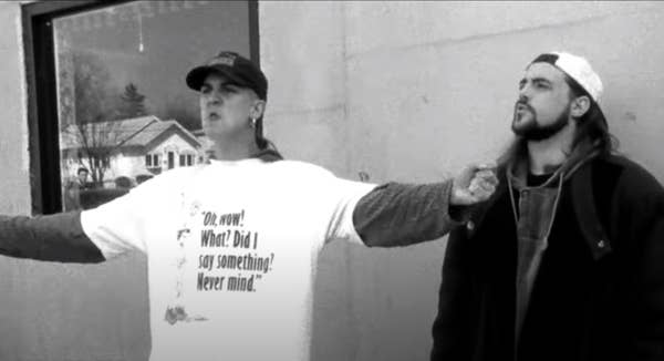Mewes as Jay pontificates with hands outstretched in front of the mini mart