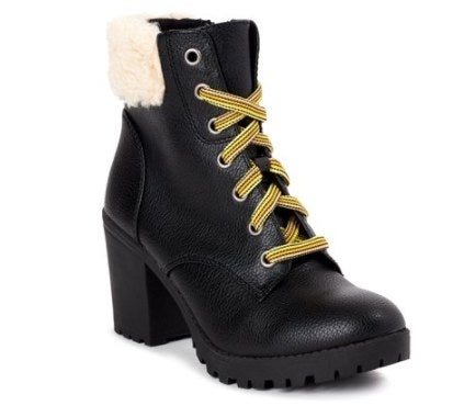 Black moto booties with yellow laces and fuzzy tops
