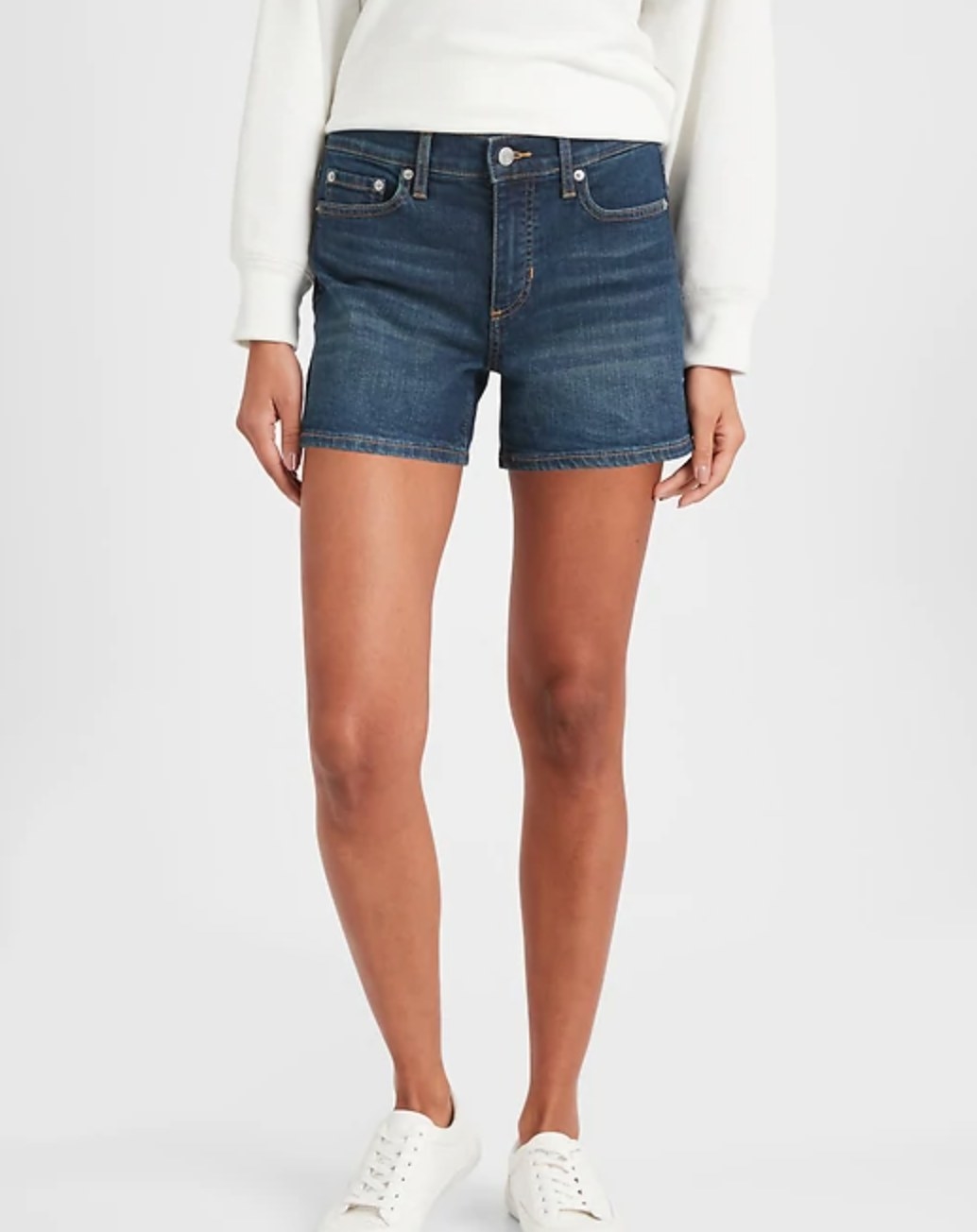 The pair of dark wash denim shorts in a 4 inch rise