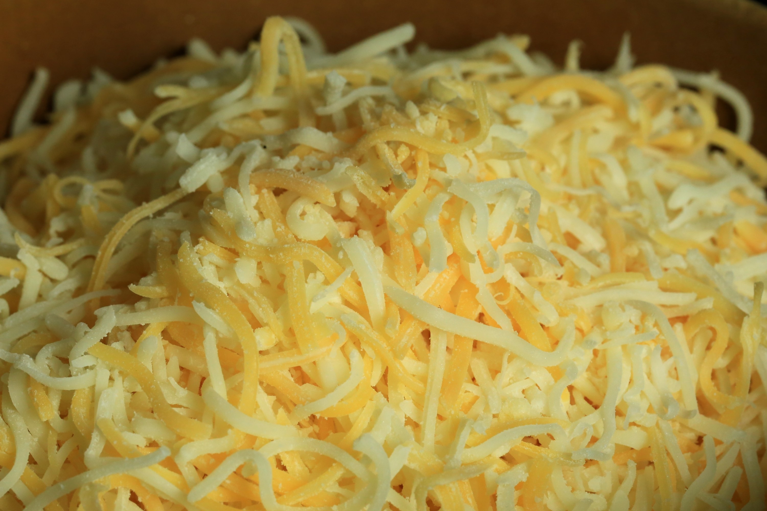 A pile of pre-shredded cheese