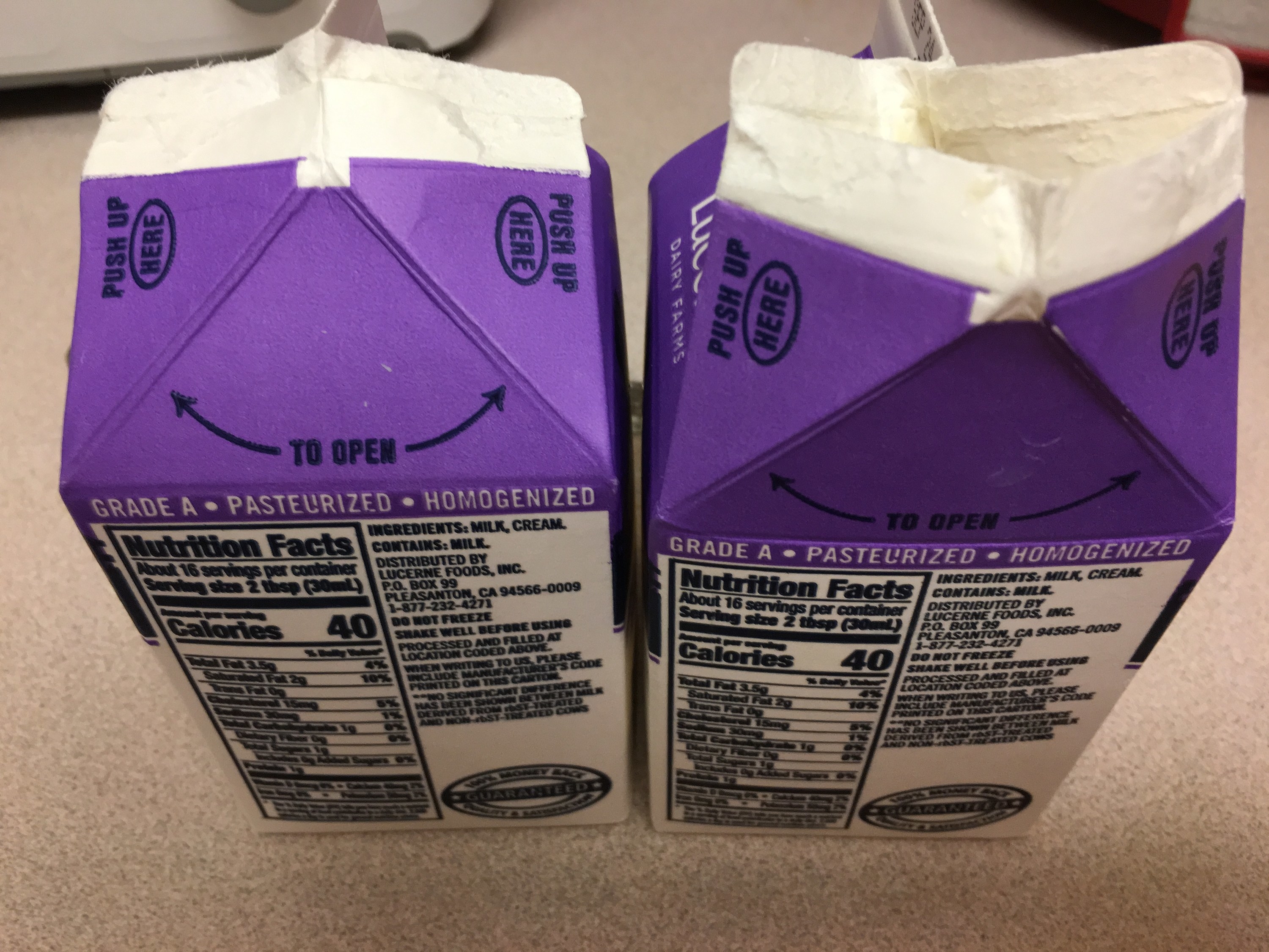 Two opened cartons of milk