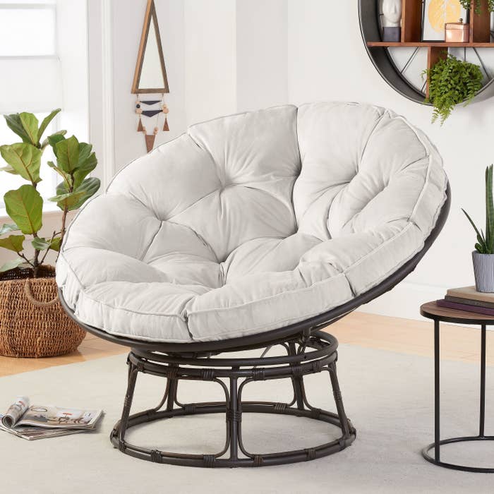 the cushion chair in gray displayed in a living room setting 