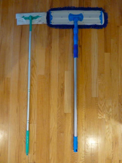 a reviewer&#x27;s photo of the larger mop system on the right compared to a smaller mop from a different brand on the left
