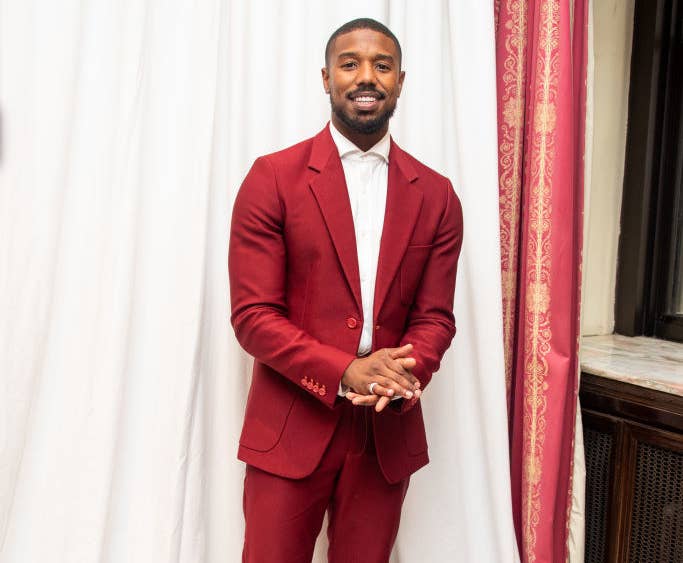 Michael B. Jordan wearing a red suit