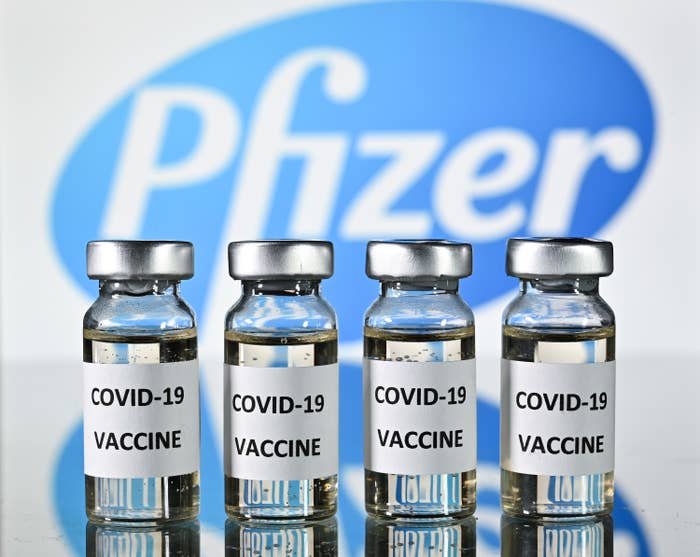 An illustration picture shows vials with Covid-19 Vaccine stickers attached, with the logo of US pharmaceutical company Pfizer.