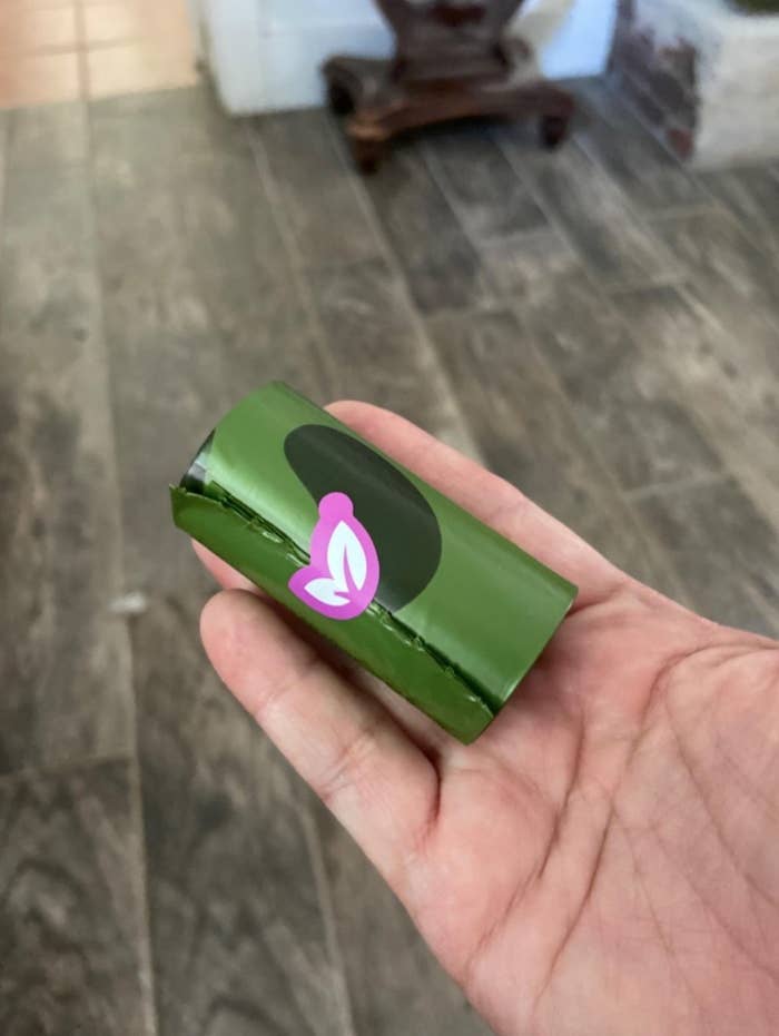 One of the poop bags in a reviewer&#x27;s hand