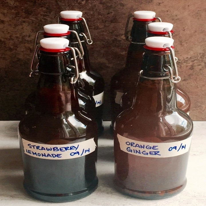 The same reviewer's photos of six completed bottles of kombucha