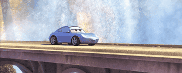 Sally from &quot;Cars&quot; driving on a bridge by a waterfall
