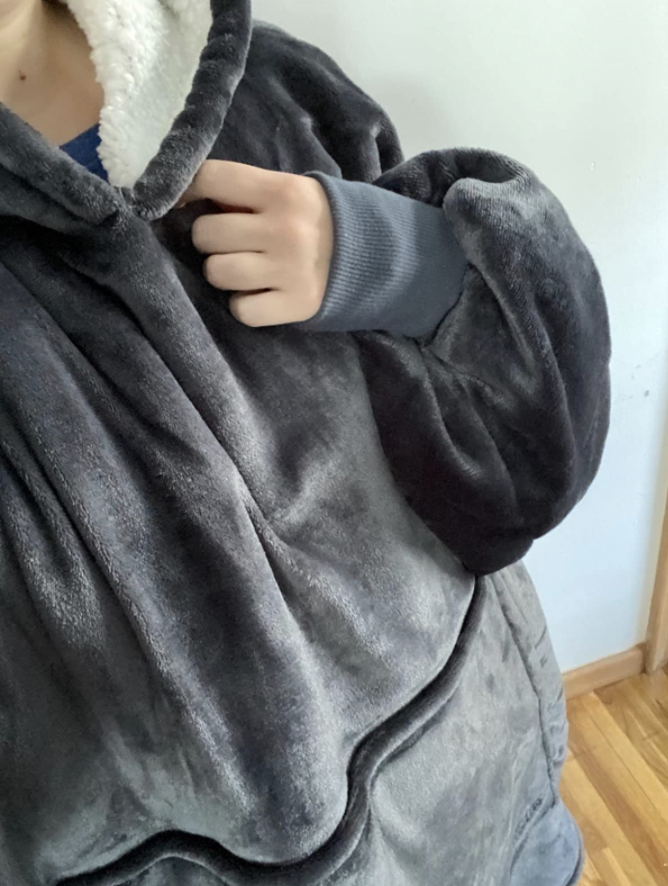 Customer wears sherpa blanket sweatshirt