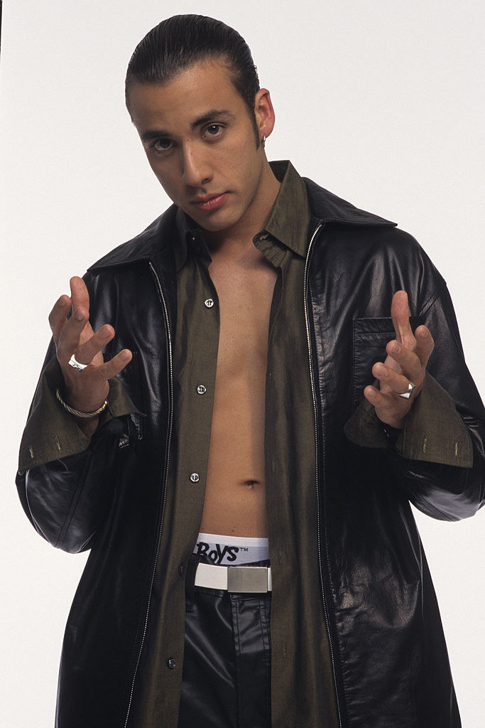 Howie D with an open shirt