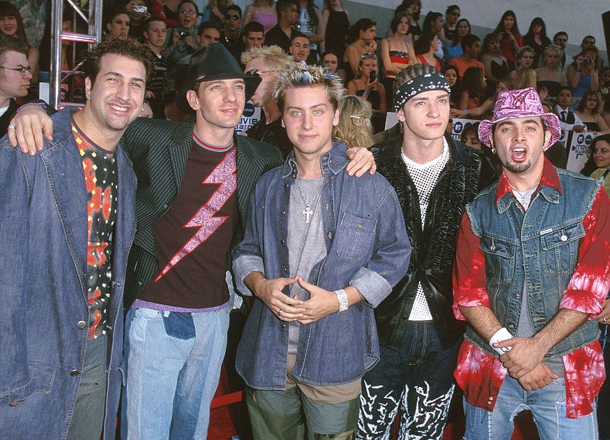 NSYNC at an awards show wearing a whole mess of clothing