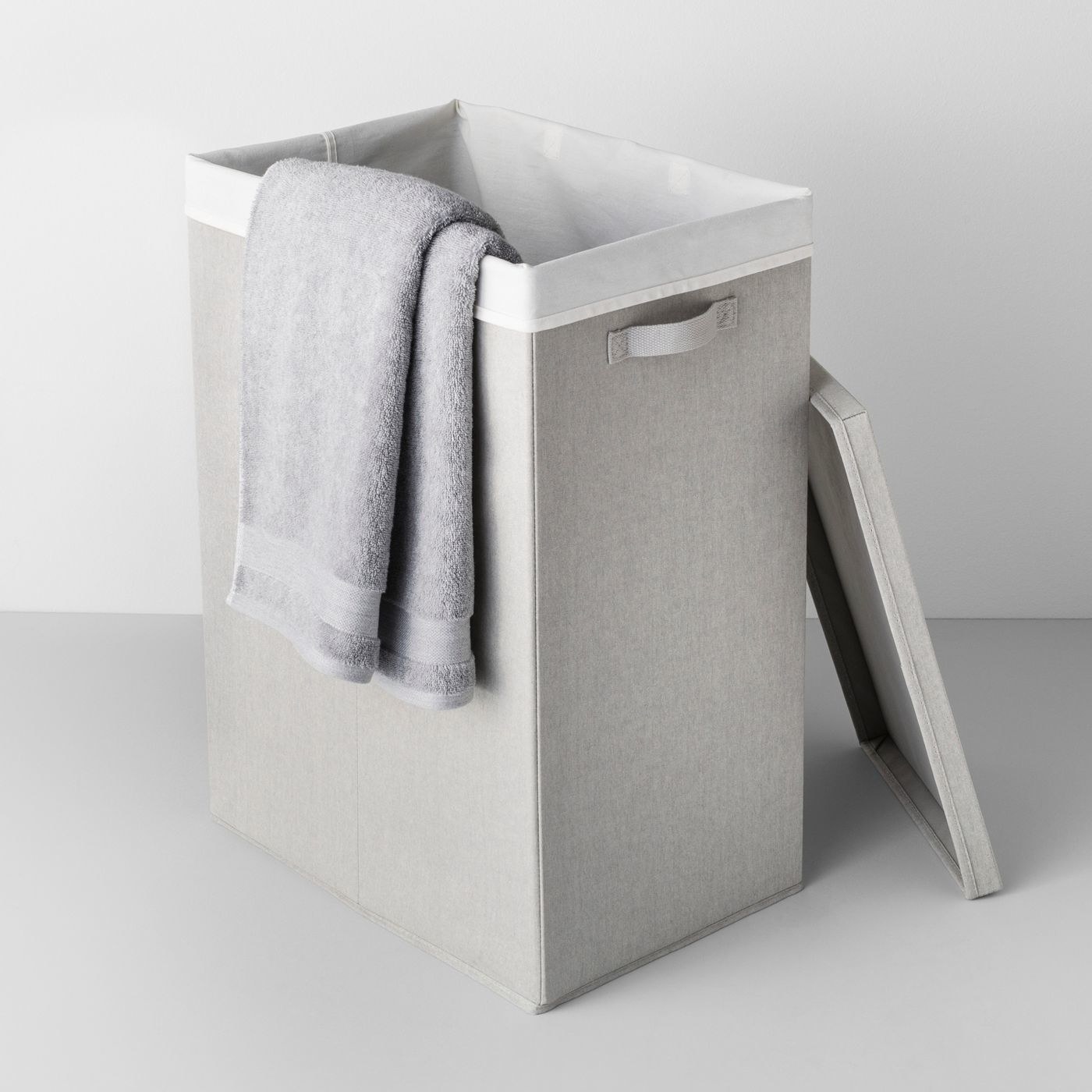 A gray fabric collapsible hamper