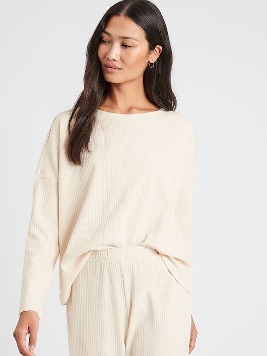 A model wearing the ribbed boatneck top in beige