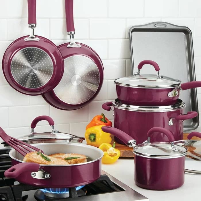 The burgundy cookware set being used in a kitchen
