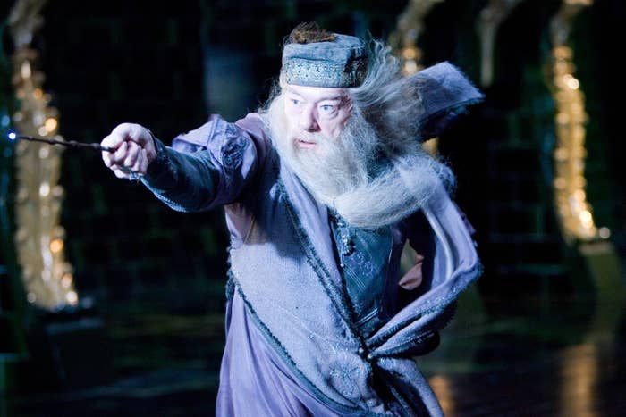 Dumbledore brandishing his wand and casting a powerful spell