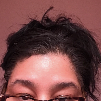 Reviewer after photo of black hair after using Root Cover Up