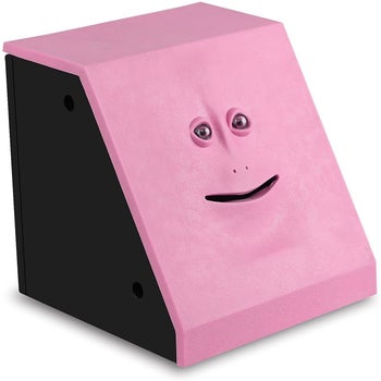 The pink piggybank with its mouth closed