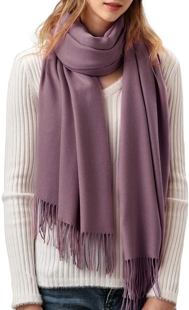 Model wearing the scarf with tassels in light mauve