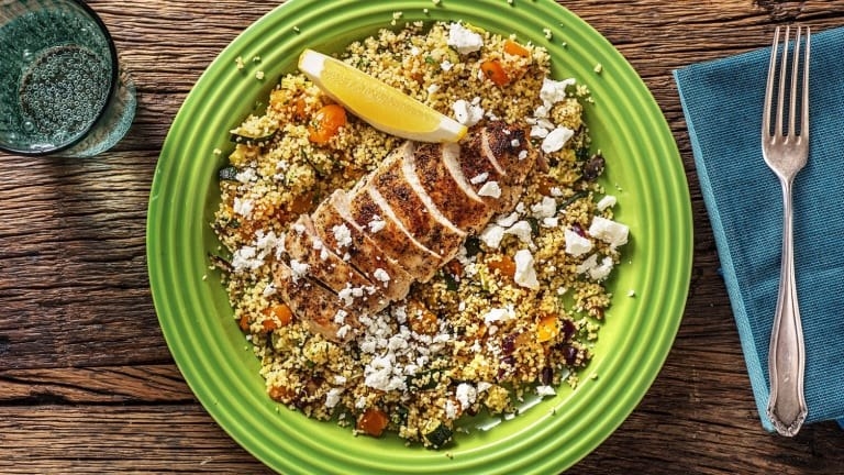 Lemon chicken with roasted vegetables and couscous and feta