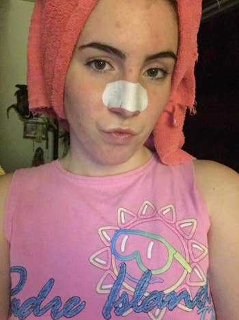 Reviewer photo of woman wearing pore strips on nose