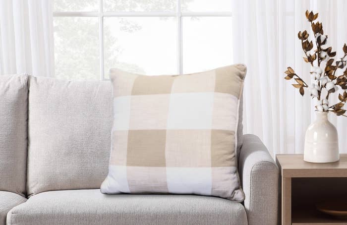 The plaid decorative pillow in white