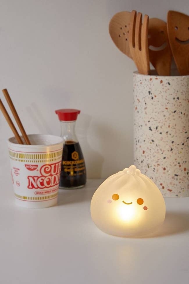 The dumpling light which is small enough to fit in the palm of a hand