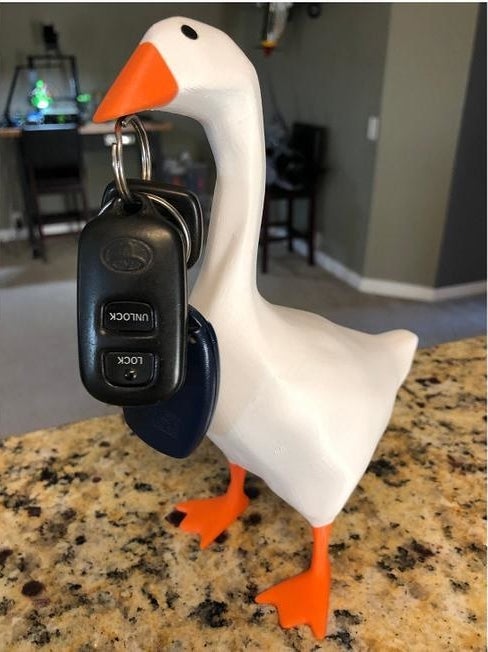 The 3D-printed good holding a set of keys with its magnetic beak