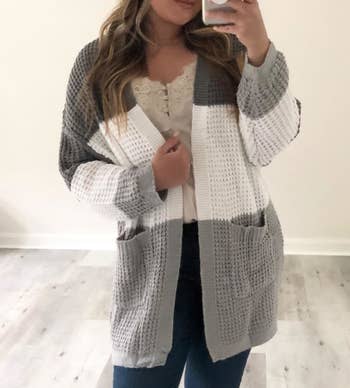 Reviewer wearing cardigan in the shade contrast-gray