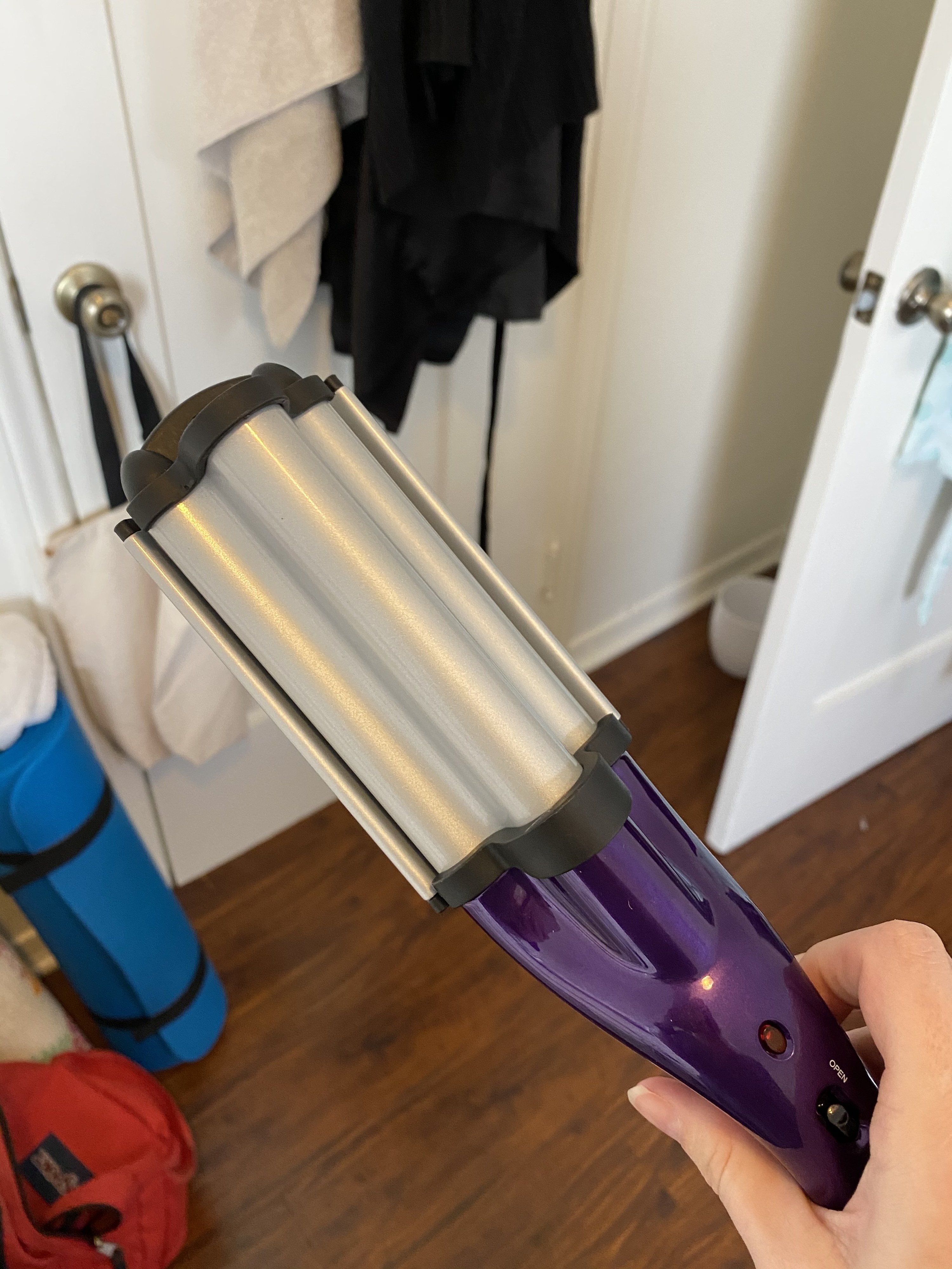 The Bed Head waver held in my hand, with two clamps and iron plates that create an &quot;S&quot; shape when held together. The tool is pretty proportional to my hand, and other hair tools, but I expected it to be much larger.